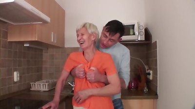 Hairy granny fucks with young guy in the kitchen